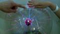 Hands at Plasma globe