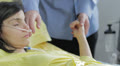 man holds the hand of his wife in the hospital