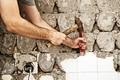 breaking ceramic tiles