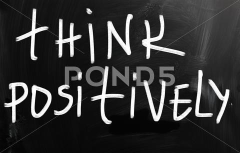 Stock Illustration of "think positively" handwritten with white chalk on a blackboard