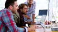 Team of designers working on computer