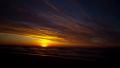 Beach Sunrise Time Lapse of Sun Peaking over Horizon