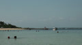 Boats and tourists at the Bali beach Video