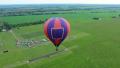 Hot air balloon top aerial view, beautiful landscape and horizon. Pilot POV Video