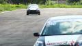 Steering race cars and track tarmac, drivers pass by Video