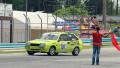 Man with red flag drives cars off track after race is finished Video