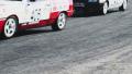 Racing cars lose rubber as they pass by sharp turn on track during competition Video