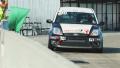 Raised green flag as sport car drives out of pit stop during race competition Video