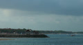 Bali coastline with pavilions and incoming airplane Video