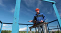 Caucasian senior manual worker maintaining gas valve gate Video