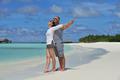 happy young couple at summer vacation have fun and relax at beach
