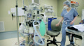 Female Doctor in the OR with machine. Dolly, Slider shot