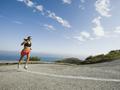 Woman running on a road in Malibu