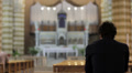 desperate man praying in a church