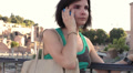 woman receives a call on his cell phone , near roman forum - steadycam Video