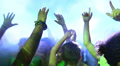 wild crowd dancing in a outdoor disco - concert - ravers - party