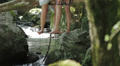 Two young women are laughing and talking and they are sitting on the tree Video