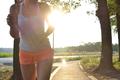 young woman running and working out in the park