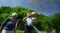 Family and friends of many generations having fun in the garden on a summer day