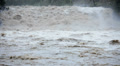 Fast flowing flooded river after rain storm, USA