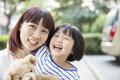 Mother and Daughter Embracing and Laughing