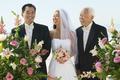 Bride And Father Looking At Groom