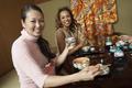Women Having Japanese Saki In Restaurant