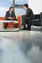 Businessmen Having Meeting In Lobby