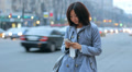 Asian Woman Typing on Phone Evening City HD