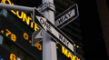 Night Stock Market Shares Ticker Close-up New York City One Way Sign Lights Video