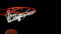 Basketball falls into hoop, slow motion