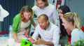 Cheerful creative business team high five each other