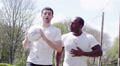 Sports men friends. Young attractive male friends enjoying time together. These