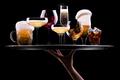 set with different drinks on black background