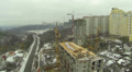 Building house in the winter with cranes. Aerial Video
