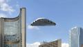 triangle ufo flying over skyscraper