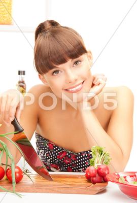 Stock photo of beautiful woman in the kitchen