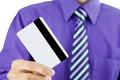 businessman holding a credit card