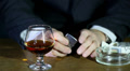 Cognac, lighter and time. Nervous businessman. Video