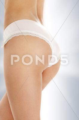 Stock photo of voluptuous back in pink panties