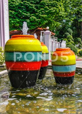 Stock photo of colorful jar pot fountain