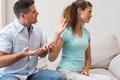 Couple arguing in living room