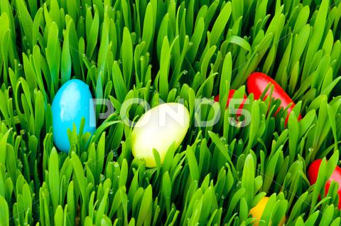 Stock photo of Easter concept - colourful eggs in green glass