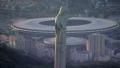 Closeup aerial view of Christ the Redeemer Statue and Maracana Stadium