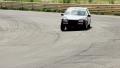 Race car drifting while taking sharp corner at high speed Video