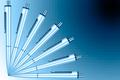 Fan of pens on a blue graduated background