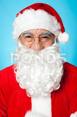 Stock photo of Profile shot of smiling Father Santa
