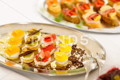 Stock photo of Appetizers mini desserts on catering buffet plate