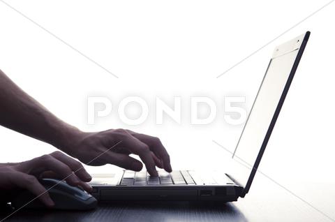 Stock photo of User Typing On Laptop Keyboard