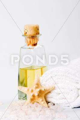 Stock photo of sea salt, towel, oil and stars